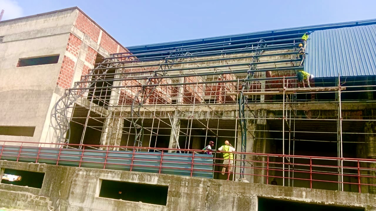 Freedom Centre building with blue aluminium roofing and scaffolding